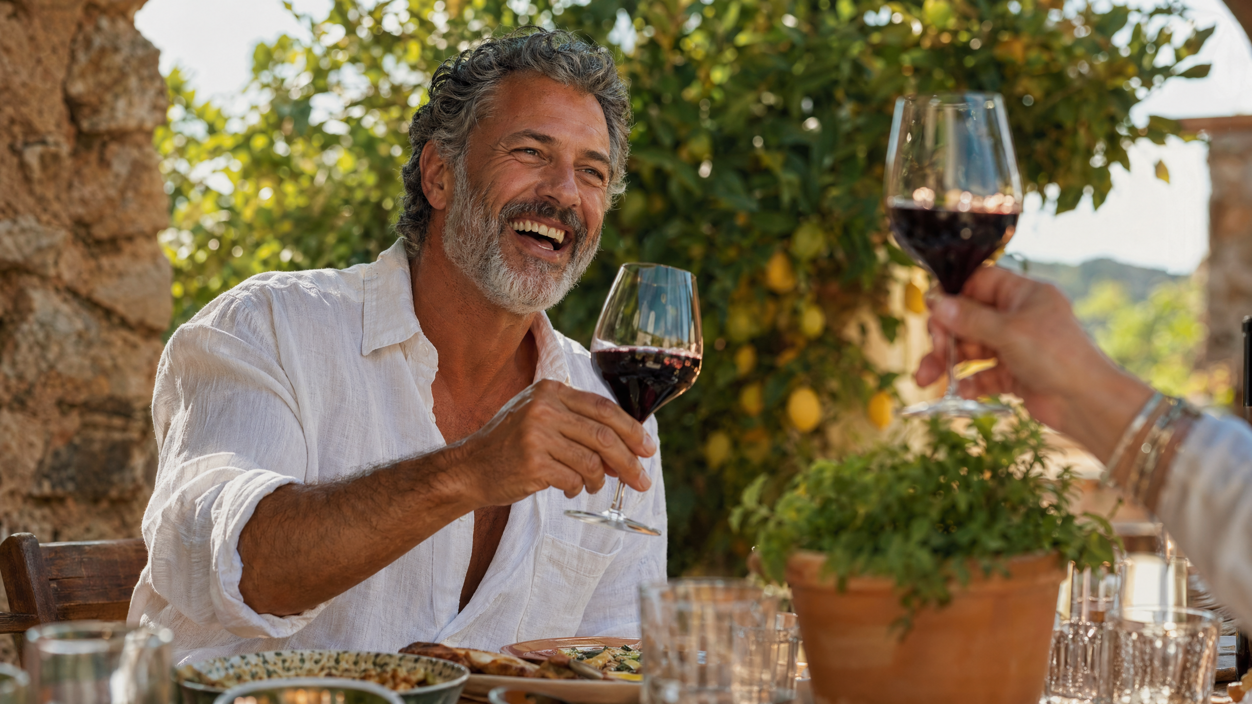 An Allure Dental restorative-dentistry patient laughing at an outdoor lunch