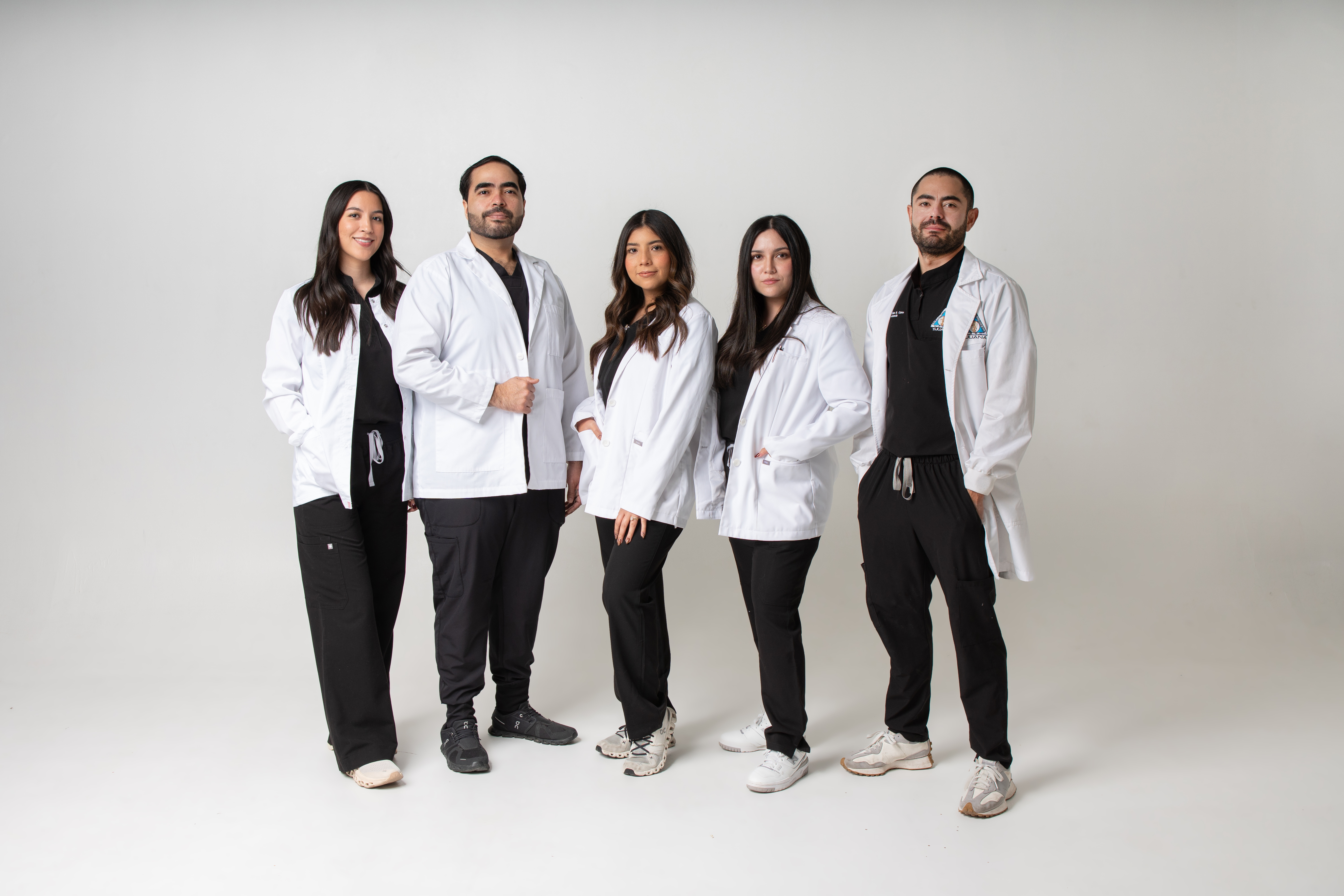 The Allure Dental clinical team in white lab coats, group portrait