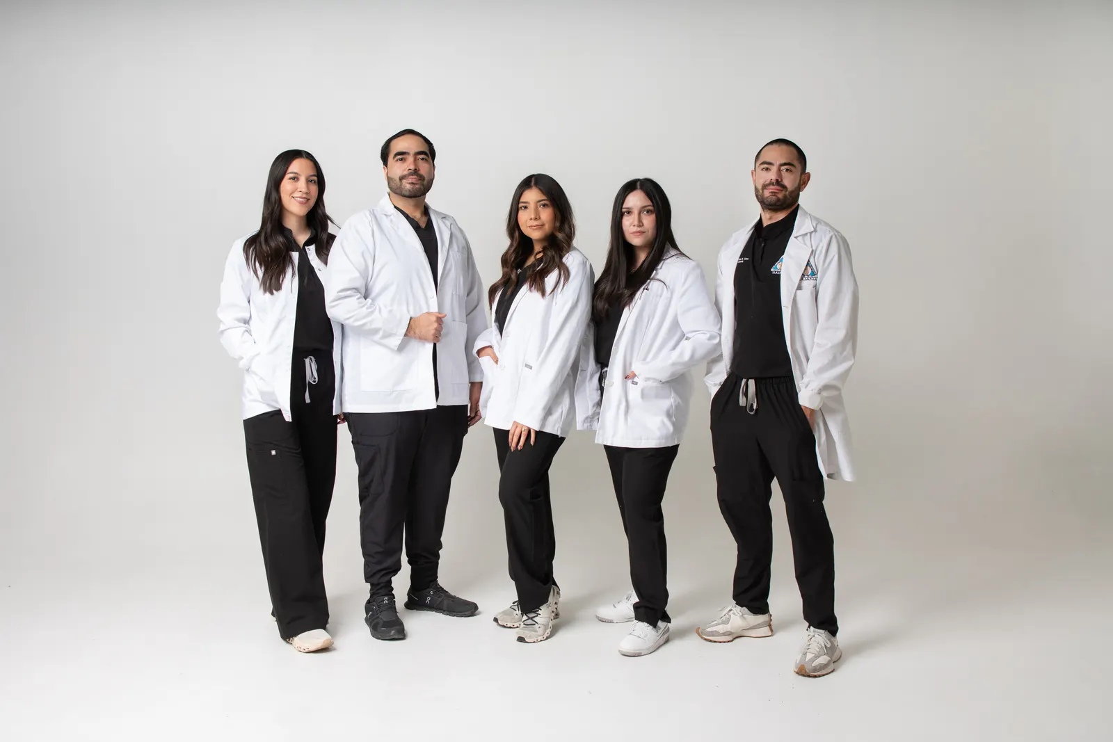 The Allure Dental clinical team in white lab coats, group portrait