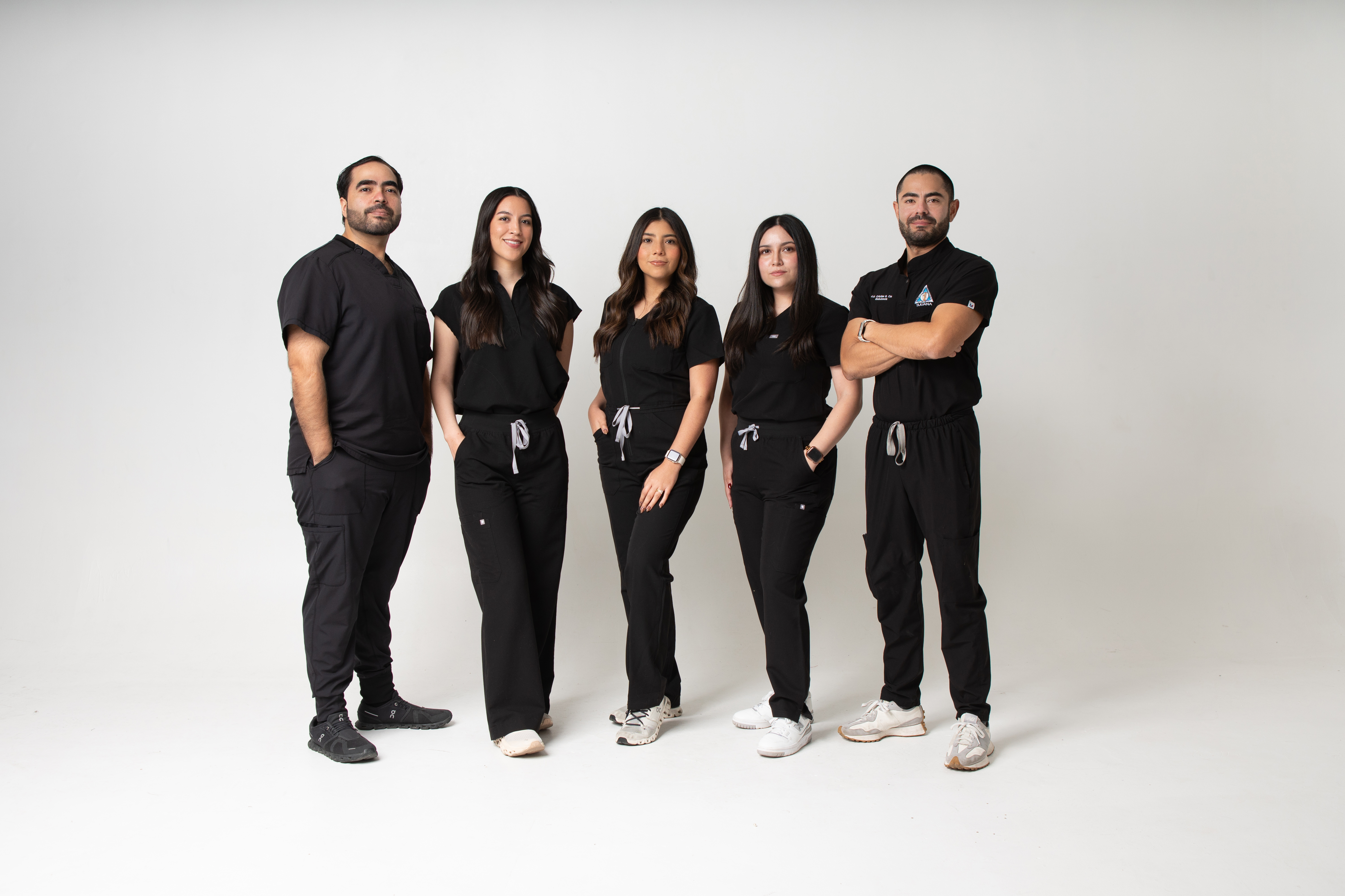 The Allure Dental team in clinic uniform, group portrait