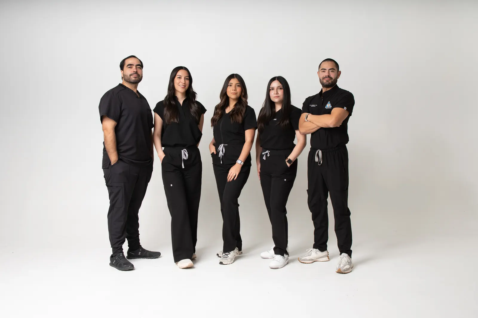 The Allure Dental team in clinic uniform, group portrait