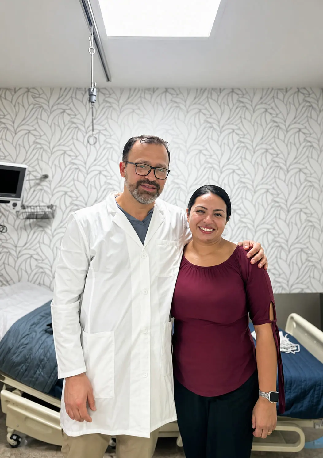 Dr. Marco Casta&ntilde;eda with a patient at the partner clinic, post-treatment