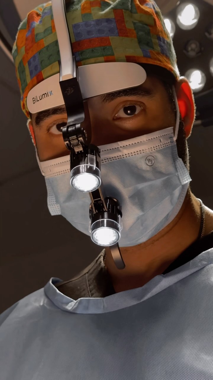 Close-up of Dr. Monta&ntilde;o focused during surgery, surgical loupes in view