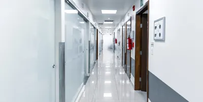 Long bright main corridor with glass operatories at the Tijuana clinic